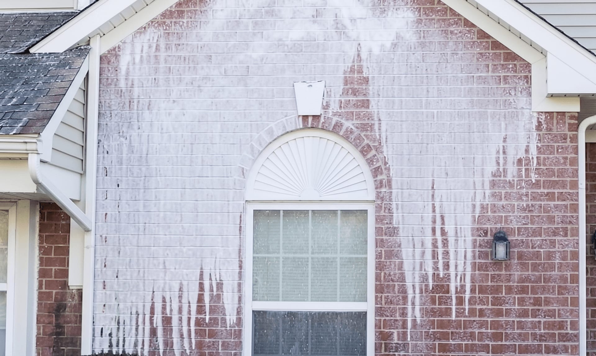 Soft washing a home exterior in Cape Coral, FL