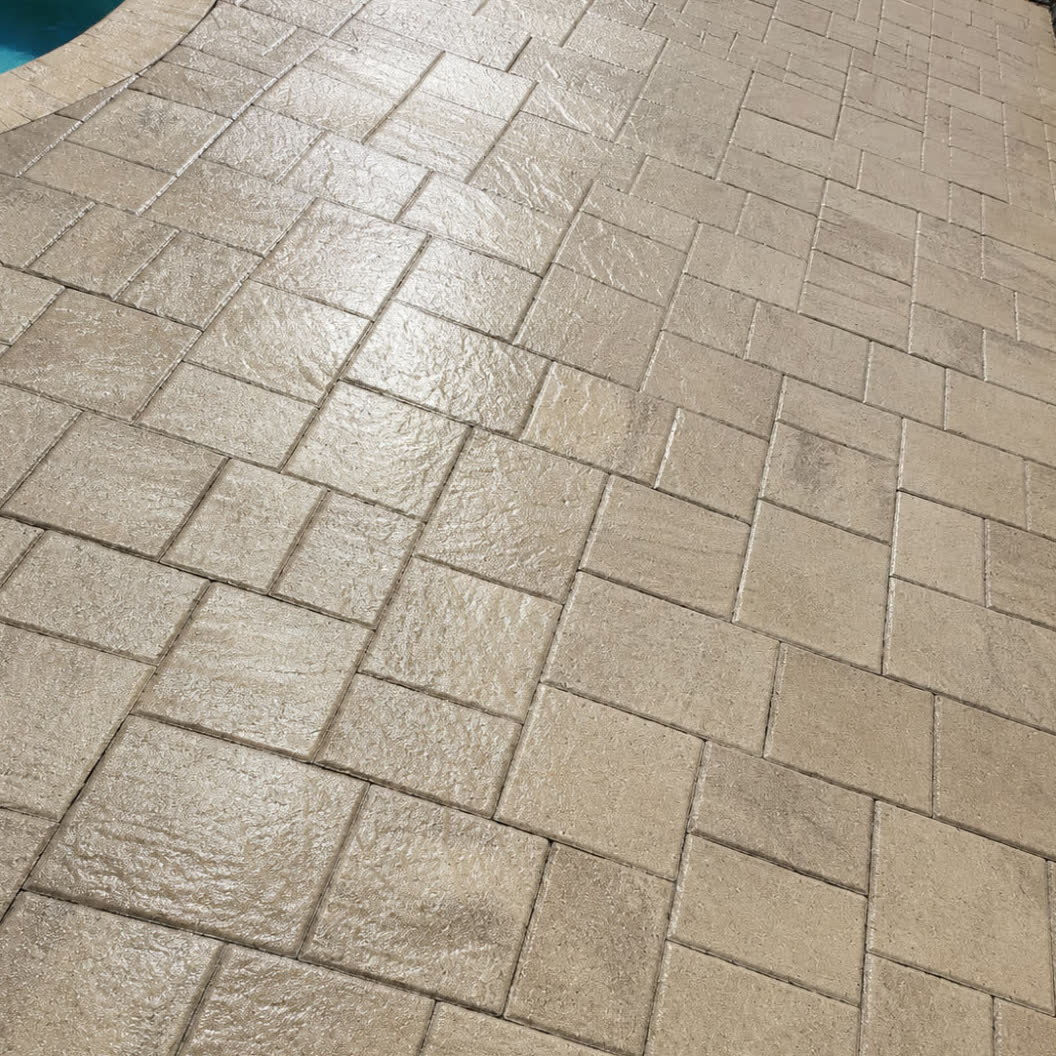 Paver pool deck after sealing — even sheen and warm colour