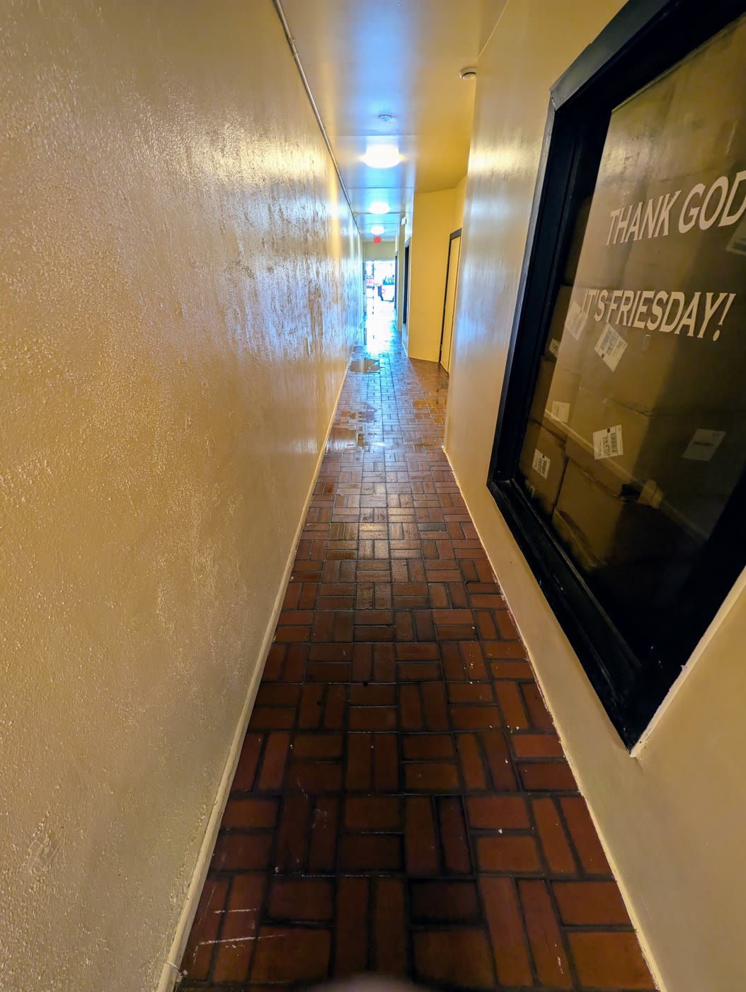 Freshly washed brick-tile commercial walkway in Fort Myers